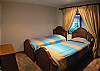 Third bedroom with Twin beds, black-out curtains and ample closet at Casa Colonial at Hermosa Palms gated community in Playa Hermosa, Costa Rica