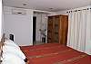 Bedroom 3 has 2 Twin beds that easily convert to a King bed with a special wedge as in this picture.  The bedroom is on the bottom level and has ensuite bathroom at Casa Infinito luxury vacation rental home at Valle Perdido in Playa Hermosa, Costa Rica