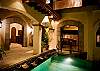 Pool and courtyard by night at Villa Antigua luxury vacation rental home in south Jaco beach, Costa Rica