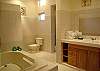 Shared bathroom between the second and third bedrooms with bathtub and shower at Casa La Ostra vacation rental house in the exclusive Hermosa Palms beachfront gated community, Playa Hermosa, Costa Rica