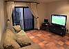 Living area with sofabed with Double size mattress (sleeps 2), and 50 inch TV on second floor at Casa Colonial at Hermosa Palms gated community in Playa Hermosa, Costa Rica