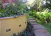 This is the entrance to the property through the gardens and pool at Sonidos del Rio, Vacation Rental, Jaco Costa Rica.