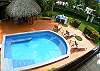 Pool area, gazebo and lawn seen from second floor balcony of Casa de Somers vacation rental home in Esterillos near Manuel Antonio
