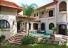 Spanish colonial design with courtyard and pool in center at Villa Antigua luxury vacation rental home in south Jaco beach, Costa Rica