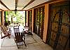 Entrance with covered patio, furniture and charcoal grill at Hermosa Palms Casa McDermott vacation rental house in Playa Hermosa, near Jaco, Costa Rica