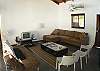 Living area with TV/DVD, stereo with CD player and very comfortable couches and sofa bed at Casa Gris vacation rental home in Jaco, Costa Rica