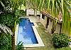 Lush tropical vegetation around lap pool at Casa Colonial vacation rental house in Hermosa Palms, Playa Hermosa, Costa Rica