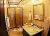 Upstairs middle bathroom with shower  at La Flor Rustico beachfront vacation rental in Jaco, Costa Rica