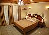 Master Bedroom with Double bed, black-out curtains and closet in Casita 1 at Villa Jaco Sol vacation rental in Jaco, Costa Rica, walking distance to beach and downtown