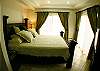 This is the Main Bedroom with king bed, Ac and TV at La Flor beachfront gated community on the North side of Jaco beach Costa Rica