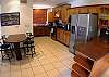 Kitchen with granite counter tops and Breakfast table and ice making refrigerator at Hermosa Palms Casa McDermott vacation rental house in Playa Hermosa, near Jaco, Costa Rica