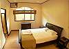 Third bedroom with Queen bed and shared bathroom at Villa Las Monas vacation rental house near Jaco, Costa Rica