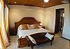 Master Bedroom with King bed and ensuite bathroom with shower, at Hermosa Palms Casa McDermott vacation rental house in Hermosa beach, near Jaco, Costa Rica.