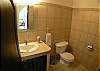 Half bathroom next to living area at Villa Las Monas vacation rental house near Jaco, Costa Rica