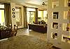 This is a parcial view of the beautiful decorated dining and living room seen from the kitchen at Casa La Ostra vacation rental house in the exclusive Hermosa Palms beachfront gated community, Playa Hermosa, Costa Rica