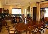 Upstairs Dining table for 8 guests next to the gourmet kitchen with breakfast counter at Casa Tortuga vacation rental home at Hermosa Palms in Playa Hermosa, Costa Rica