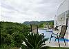 Pool with infinity edge and rainforest view at Casa Infinito luxury vacation rental home at Valle Perdido in Playa Hermosa, Costa Rica