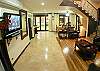 This is the a view to the living and dining room seen from the entrance door at La Flor beachfront gated community on the North side of Jaco beach Costa Rica