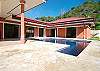 View of house and pool seen from the garden at Casa Las Monas vacation rental house near Jaco, Costa Rica