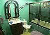 Master bathroom with combination shower/bathtub at La Flor del Paraiso vacation rental home in Jaco's only beachfront single-family home gated community.