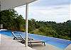 Pool with infinity edge and ocean and rainforest view at Casa Infinito luxury vacation rental home at Valle Perdido in Playa Hermosa, Costa Rica
