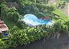 Aerial view of Hermosa Palms beachfront community pool, just a few steps from Casa Colonial vacation rental house, in Playa Hermosa, Costa Rica