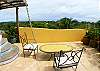 Ocean view roof top terrace with whirlpool, table with chairs and bathroom at Casa Exotica vacation rental home in Esterillos, Costa Rica