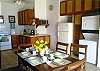 Solid wood dining table for six guests at our Mar Arena vacation rental condo in Jaco, Costa Rica.
