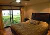 Master Bedroom with ocean view, wood frame King Bed, ample closet space and ensuite bathroom  at Casa Colonial at Hermosa Palms gated community in Playa Hermosa, Costa Rica