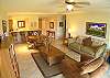 Living area with comfortable seating for 4 and TV at Del Mar 5N vacation rental condo at Los Suenos Resort & Marina, Playa Herradura, Costa Rica