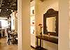 Foyer with world art objects and vaulted brick ceiling at Hermosa Palms Villa La Costa luxury vacation rental in Playa Hermosa, Costa Rica