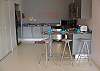 Kitchen and breakfast table with bar at Jaco Bay 4701 vacation rental condominiums in Jacobeach