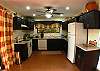 Full kitchen with dishwasher at La Flor Rustico beachfront vacation rental in Jaco, Costa Rica