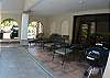 Pool area with terrace including charcoal BBQ, lounge chairs and table at Casa Colonial vacation rental home at Hermosa Palms in Playa Hermosa, Puntarenas