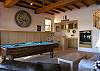 Includes wet bar, pool table and TV