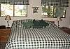 This room is located upstairs in the loft and has an attached bath.  It has a king size bed.