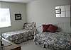 3 twins beds in the room and is located on the main level.