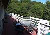 Sun and shady deck with view of trees