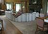 Fireplace is located on the main level and is open to the game table and dining area.