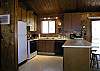 Convenient kitchen with breakfast bar.