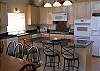 This kitchen has all the modern conveniences with granite counter tops and easy care laminate floors and is open to the dining area and living room.