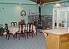 This room  has a wood burning stove and is open to the Living room and kitchen.  French doors lead out onto the patio.