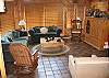 Open to the dining area and kitchen, has sliding glass dorrs that open out onto the deck.