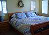 This room has a king size bed with an attached bath.