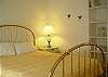 Located on the lower level next to the bonus room and has a queen size bed.