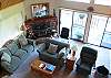 This room is on the main level and is open to the dining area and kitchen.  Sliders open out onto the upper deck.