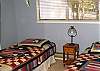 This bedroom is located on the main level and has 2 twin beds.