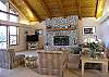 On the main level and open to the dining area and the kitchen.