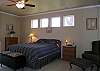 Nicely appointed with a queen sized bed and has french doors leading out onto the deck.  Attached master bath.