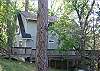 A few stairs from parking area brings you down on to the deck and front door.